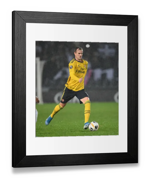 Framed Print : Rob Holding in Action: Arsenal's Europa League Clash vs Vitoria Guimaraes