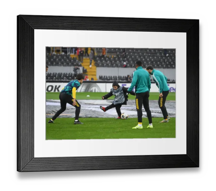 Framed Print : Arsenal Players Engage in Pre-Match Fun with Ballboy Ahead of Vitoria Guimaraes Clash, UEFA Europa League 2019-20