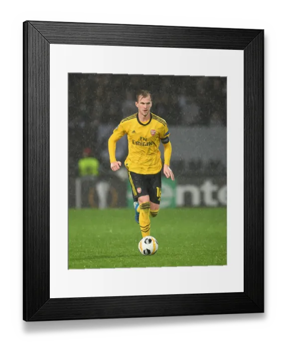 Framed Print : Rob Holding in Action: Arsenal's Europa League Clash vs. Vitoria Guimaraes