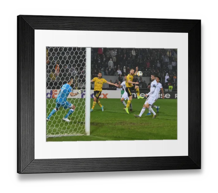 Framed Print : Mustafi's Europa League Winner: Arsenal Triumphs over Vitoria Guimaraes