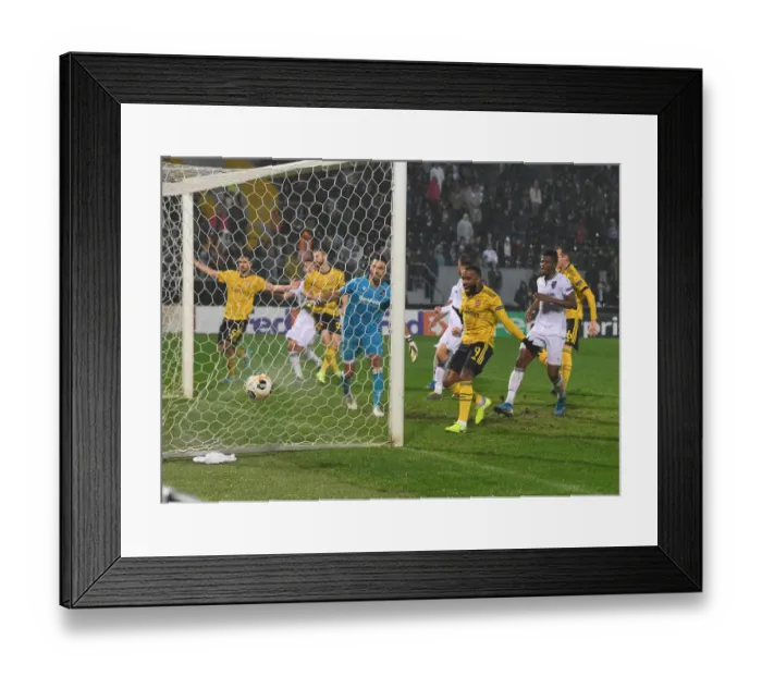 Framed Print : Mustafi Scores the Winner: Arsenal Triumphs Over Vitoria Guimaraes in Europa League
