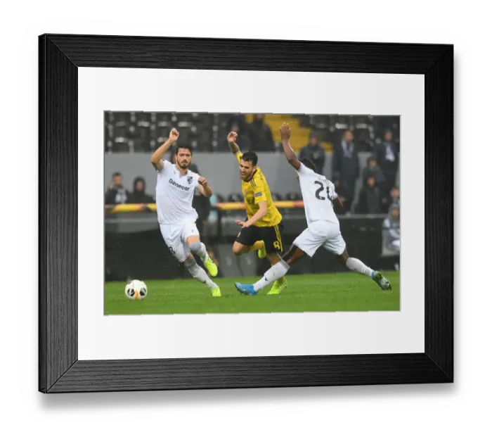 Framed Print : Dani Ceballos Clashes with Pepe and Mikel Agu during Arsenal's UEFA Europa League Match against Vitoria Guimaraes