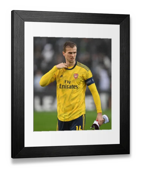 Framed Print : Arsenal's Rob Holding Braces for Vitoria Guimaraes Clash in Europa League Group F