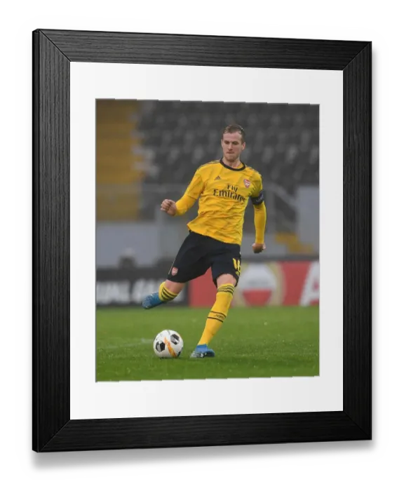Framed Print : Rob Holding in Action: Arsenal's Europa League Clash vs Vitoria Guimaraes Framed Print : Rob Holding in Action: Arsenal's Europa League Clash vs Vitoria Guimaraes