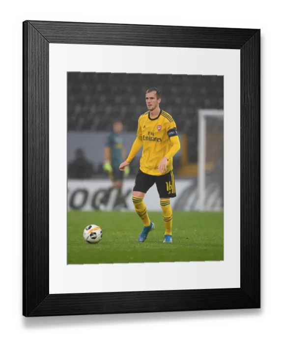 Framed Print : Rob Holding in Action: Arsenal's Europa League Battle against Vitoria Guimaraes Framed Print : Rob Holding in Action: Arsenal's Europa League Battle against Vitoria Guimaraes