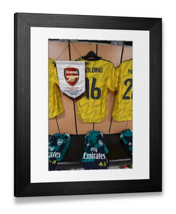 Framed Print : Arsenal's Rob Holding Displays Europa League Pennant Ahead of Vitoria Guimaraes Clash Framed Print : Arsenal's Rob Holding Displays Europa League Pennant Ahead of Vitoria Guimaraes Clash
