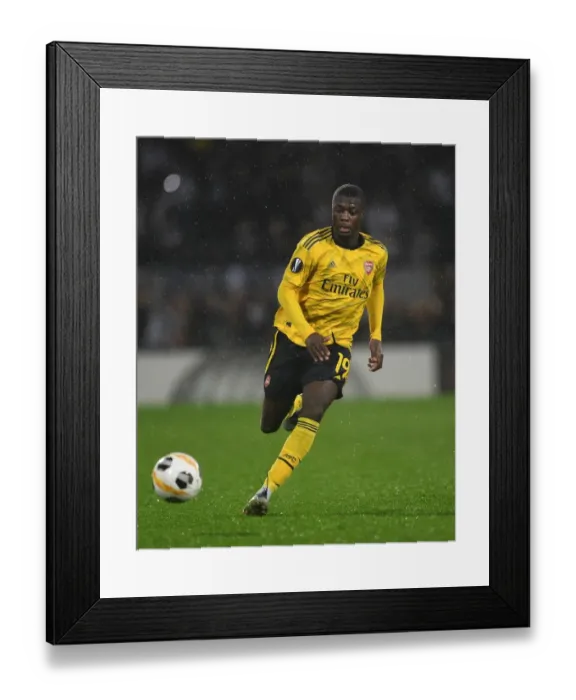 Framed Print : Nicolas Pepe in Action: Arsenal vs Vitoria Guimaraes, UEFA Europa League 2019-20