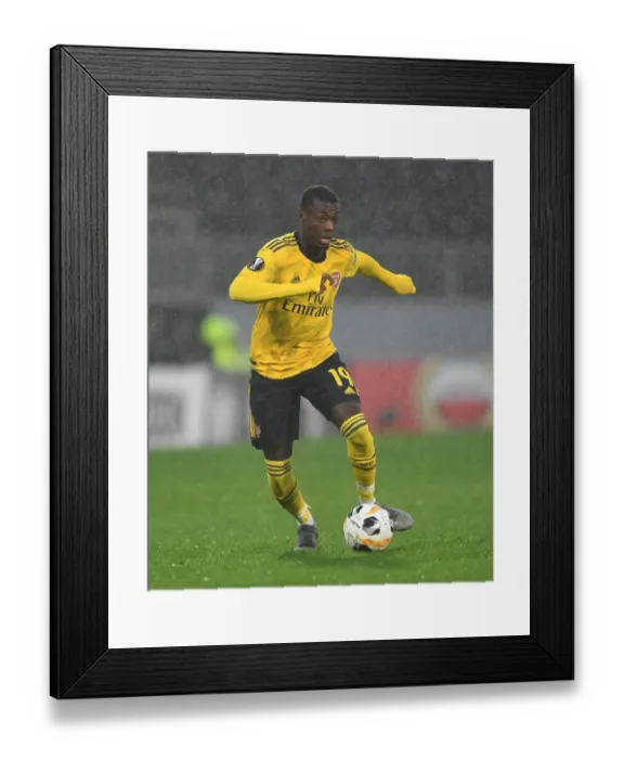 Framed Print : Arsenal's Nicolas Pepe Shines in Europa League Clash against Vitoria Guimaraes