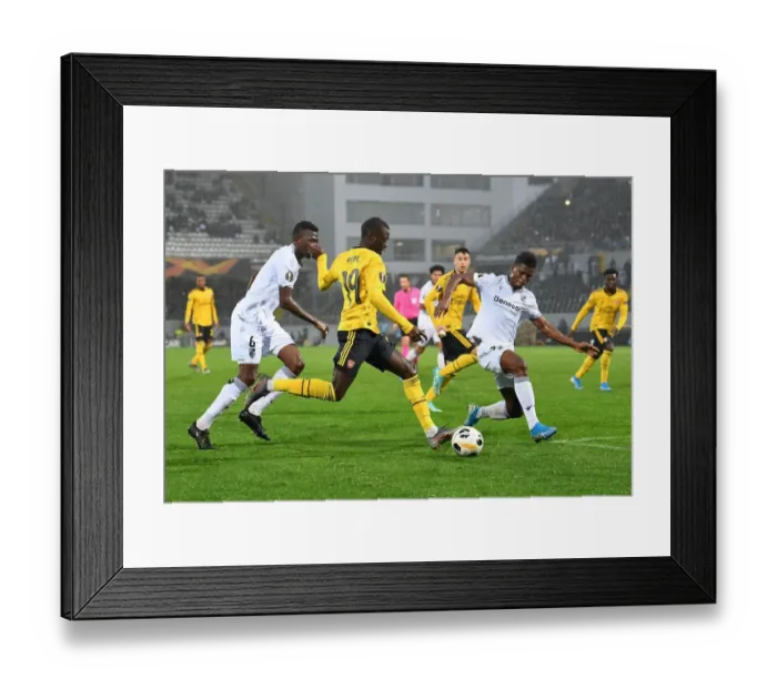 Framed Print : Pepe Crosses Under Pressure: Arsenal vs. Vitoria Guimaraes, UEFA Europa League (Group F)