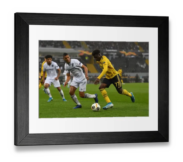 Framed Print : Bukayo Saka Faces Off Against Victor Garcia: Vitoria Guimaraes vs. Arsenal, UEFA Europa League, Group F (November 2019)