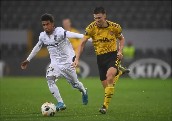 Arsenal's Kieran Tierney Clashes with Marcus Edwards in Europa League Battle