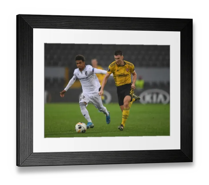 Framed Print : Arsenal's Kieran Tierney Clashes with Marcus Edwards in Europa League Battle