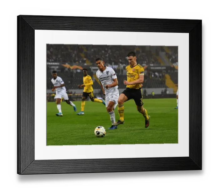 Framed Print : Arsenal's Kieran Tierney Clashes with Vitoria Guimaraes Victor Garcia in Europa League Match Framed Print : Arsenal's Kieran Tierney Clashes with Vitoria Guimaraes Victor Garcia in Europa League Match