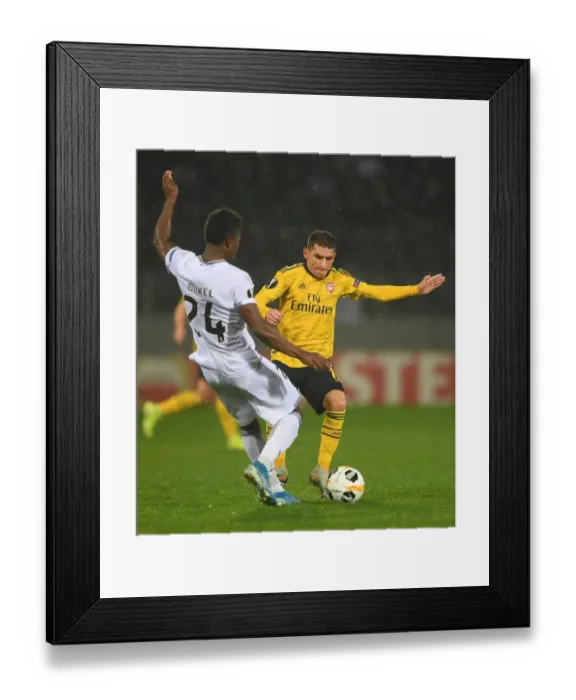 Framed Print : Torreira vs. Agu: Clash in the Europa League: Vitoria SC vs. Arsenal FC