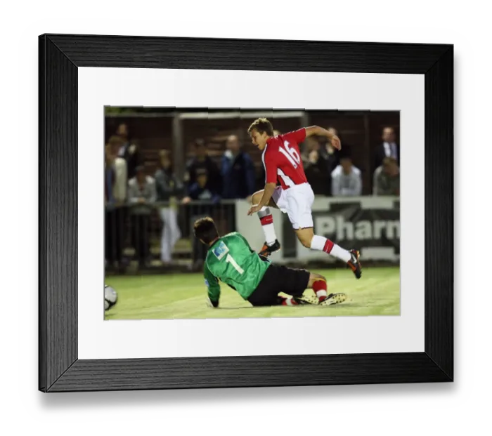 Framed Print : Luke Freeman scores Arsenals 6th goal past Chris Tardiff (Maidenhead) Framed Print : Luke Freeman scores Arsenals 6th goal past Chris Tardiff (Maidenhead)