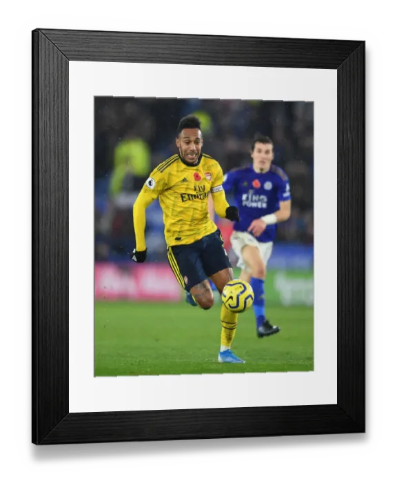 Framed Print : Arsenal's Aubameyang Goes Head-to-Head with Leicester City in Premier League Clash
