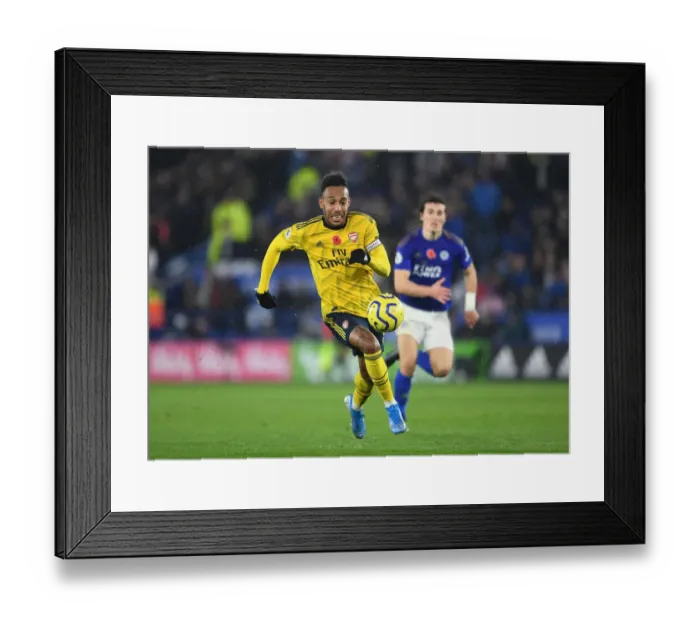 Framed Print : Arsenal's Aubameyang Goes Head-to-Head with Leicester City in Premier League Showdown Framed Print : Arsenal's Aubameyang Goes Head-to-Head with Leicester City in Premier League Showdown