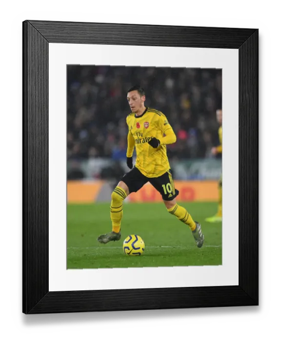Framed Print : Arsenal's Mesut Ozil in Action: Premier League Clash - Arsenal vs. Leicester City (2019-20) Framed Print : Arsenal's Mesut Ozil in Action: Premier League Clash - Arsenal vs. Leicester City (2019-20)