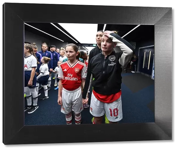 Arsenal's Kim Little and Mascot Before Tottenham Clash in FA Womens Super League