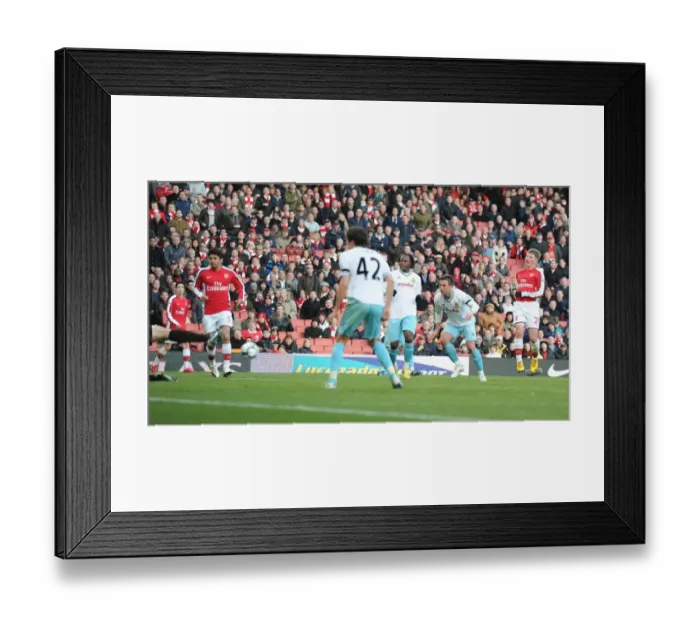 Framed Print : Andrey Arshavin shoots past Burnley goalkeeper Brian Jensen to score the srd Arsenal goal