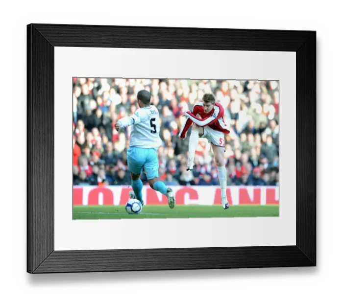 Framed Print : Nicklas Bendtner (Arsenal) Clarke Carlisle (Burnley). Arsenal 3: 1 Burnley
