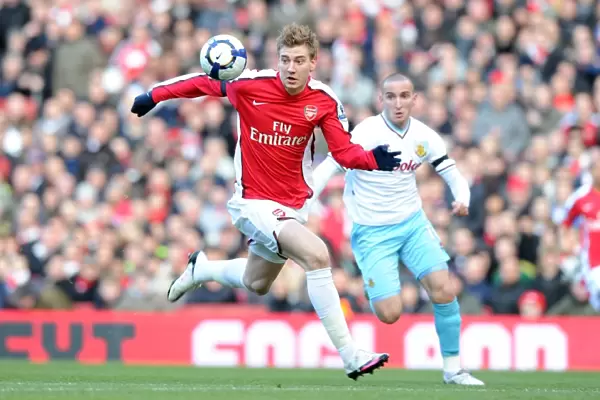 Arsenal's Bendtner Scores Against Burnley's Paterson in 3-1 Premier League Victory at Emirates Stadium, 2010