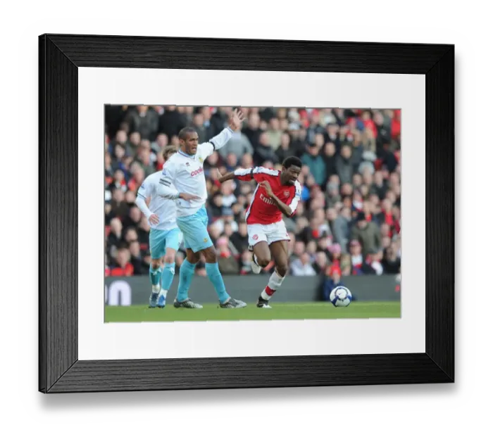 Framed Print : Abou Diaby (Arsenal) Clarke Carlisle (Burnley). Arsenal 3: 1 Burnley, Barclays Premier League Framed Print : Abou Diaby (Arsenal) Clarke Carlisle (Burnley). Arsenal 3: 1 Burnley, Barclays Premier League