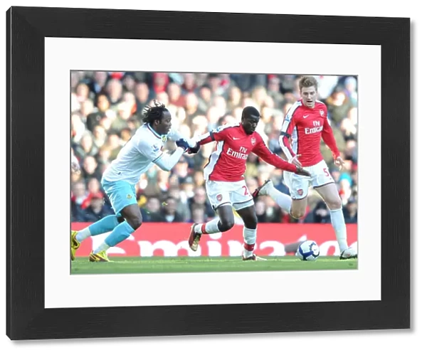 Emmanuel Eboue and Nicklas Bendtner (Arsenal) Andre Bikey (Burnley). Arsenal 3: 1 Burnley