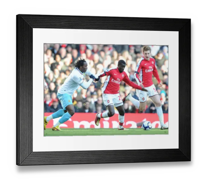 Framed Print : Emmanuel Eboue and Nicklas Bendtner (Arsenal) Andre Bikey (Burnley). Arsenal 3: 1 Burnley Framed Print : Emmanuel Eboue and Nicklas Bendtner (Arsenal) Andre Bikey (Burnley). Arsenal 3: 1 Burnley