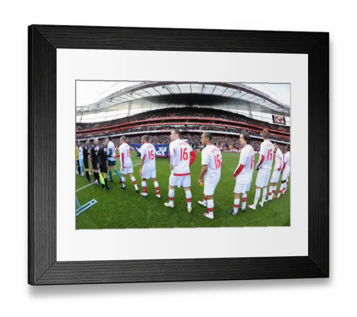 Framed Print : Arsenal players line up before the match wearing Aaron Ramsey shirts. Arsenal 3: 1 Burnley Framed Print : Arsenal players line up before the match wearing Aaron Ramsey shirts. Arsenal 3: 1 Burnley