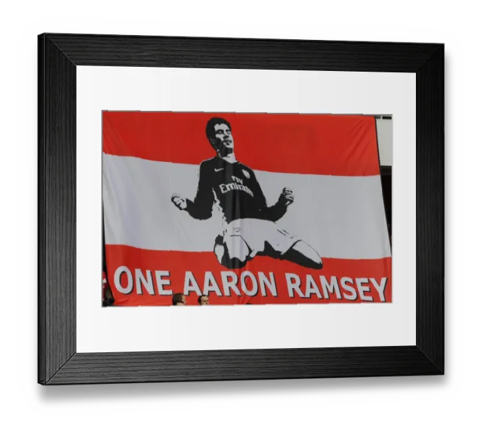 Framed Print : Arsenal fans show their support for injured Aaron Ramsey. Arsenal 3: 1 Burnley