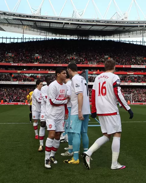 Denilson (Arsenal) shakes hands with Kevin McDonald (Burnley) before the match
