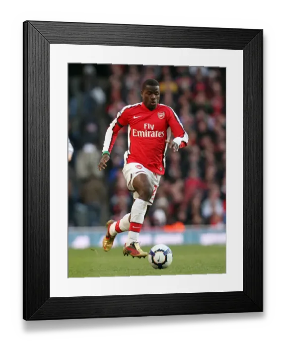Framed Print : Emmanuel Eboue's Triumph: Arsenal's 3-1 Victory Over Burnley in the Barclays Premier League