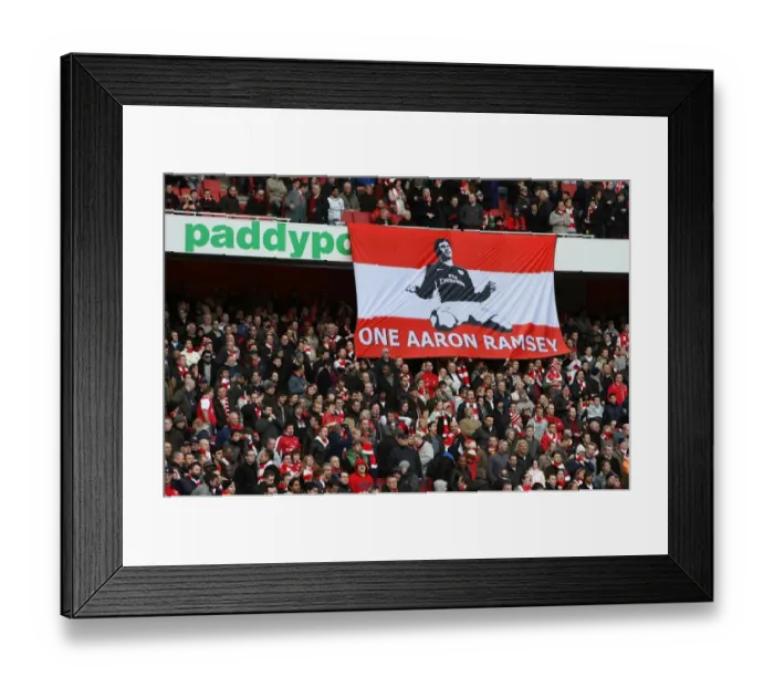 Framed Print : Arsenal Fans Rally Behind Injured Aaron Ramsey: Uniting in Support After His Broken Leg Against Burnley Framed Print : Arsenal Fans Rally Behind Injured Aaron Ramsey: Uniting in Support After His Broken Leg Against Burnley