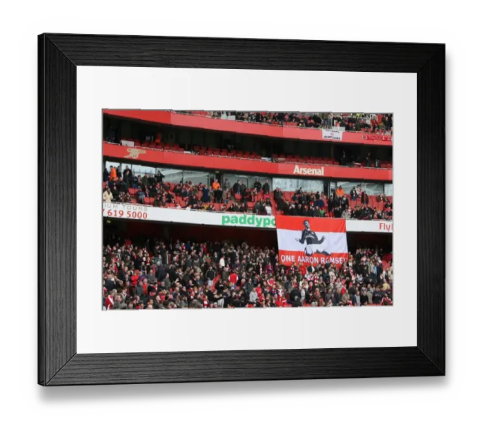 Framed Print : Arsenal Fans Unite: Rallying Behind Injured Aaron Ramsey Amidst Glory in 3:1 Victory