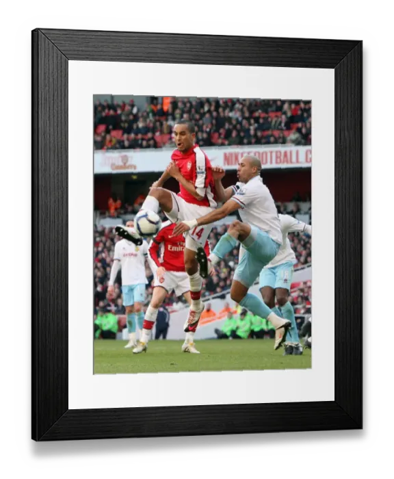 Framed Print : Theo Walcott (Arsenal) Tyrone Mears (Burnley). Arsenal 3: 1 Burnley. Barclays Premier League Framed Print : Theo Walcott (Arsenal) Tyrone Mears (Burnley). Arsenal 3: 1 Burnley. Barclays Premier League