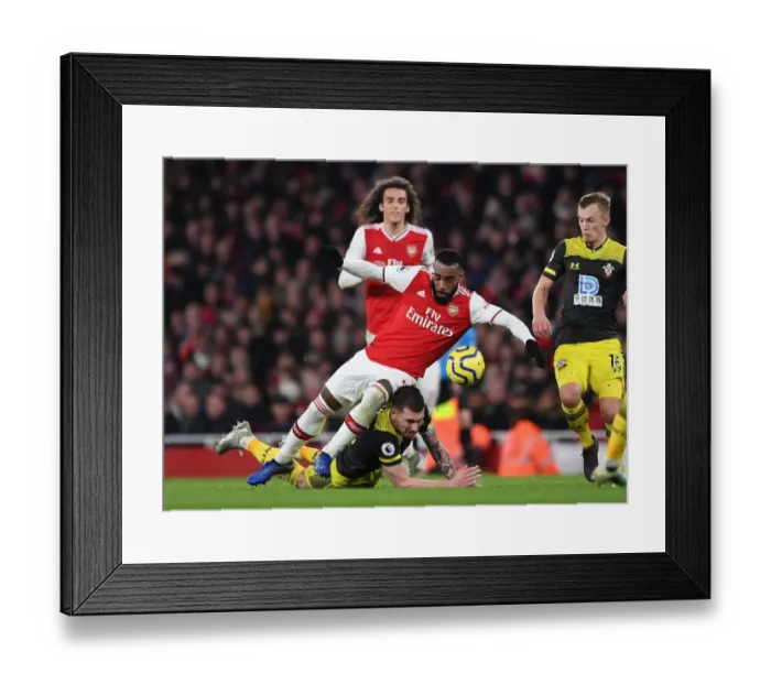 Framed Print : Lacazette vs Hojbjerg: A Premier League Showdown at the Emirates