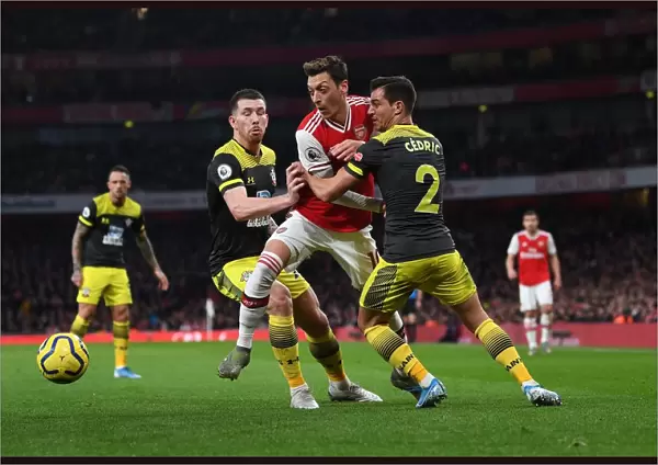 Arsenal vs Southampton: Ozil Faces Off Against Hojbjerg and Cedric