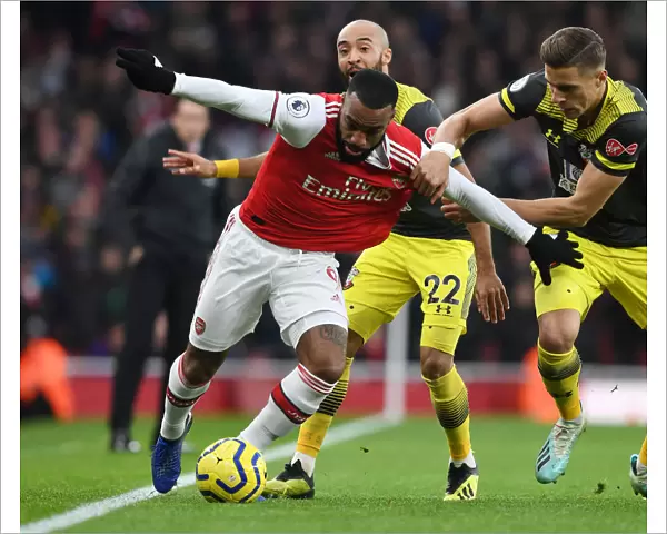 Arsenal's Alex Lacazette Outmaneuvers Southampton's Jan Bednarek in Premier League Clash