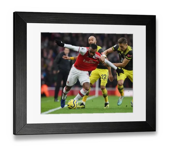 Framed Print : Arsenal's Alex Lacazette Outmaneuvers Southampton's Jan Bednarek in Premier League Clash