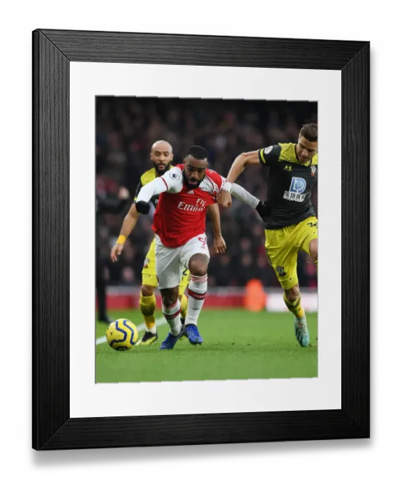 Framed Print : Arsenal's Lacazette Outwits Southampton's Bednarek: A Premier League Tactical Battle at Emirates Stadium