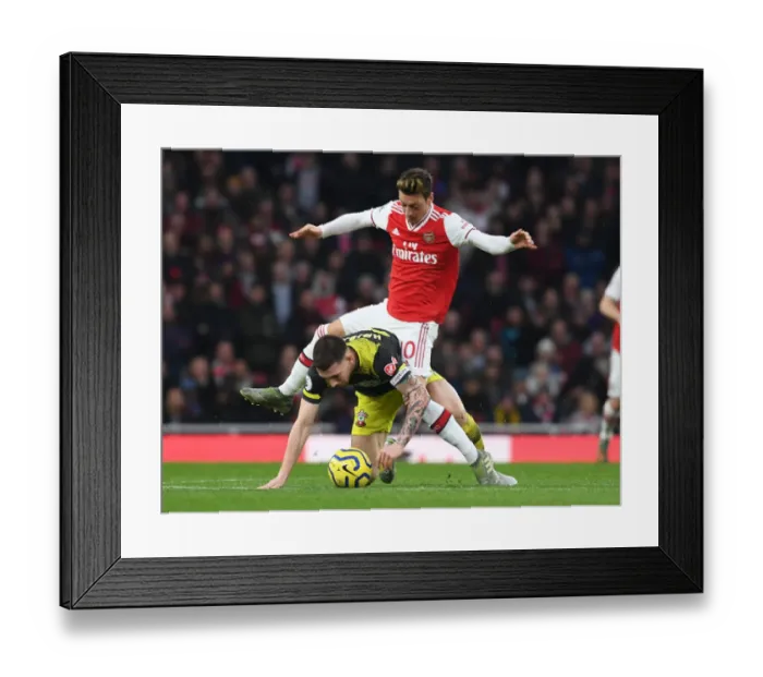 Framed Print : Ozil vs Hojbjerg: A Premier League Showdown at the Emirates