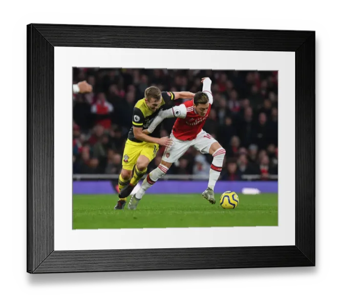 Framed Print : Arsenal vs Southampton: Mesut Ozil Clashes with James Ward-Prowse in Premier League Showdown Framed Print : Arsenal vs Southampton: Mesut Ozil Clashes with James Ward-Prowse in Premier League Showdown