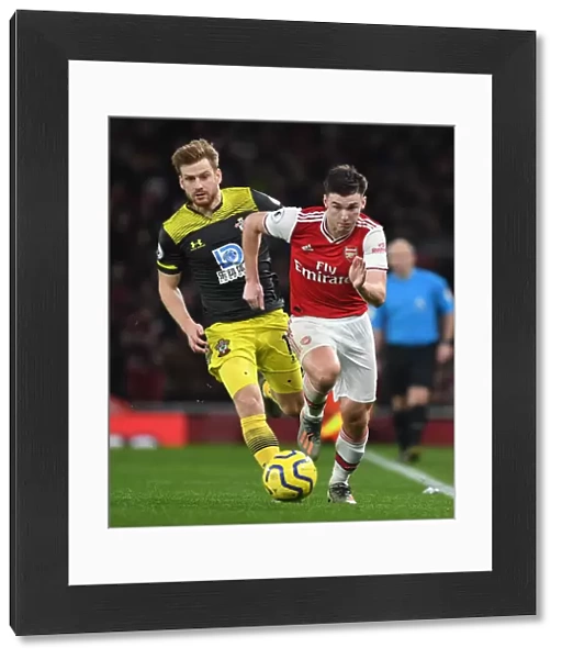 Arsenal's Kieran Tierney Outmaneuvers Southampton's Stuart Armstrong in Premier League Clash