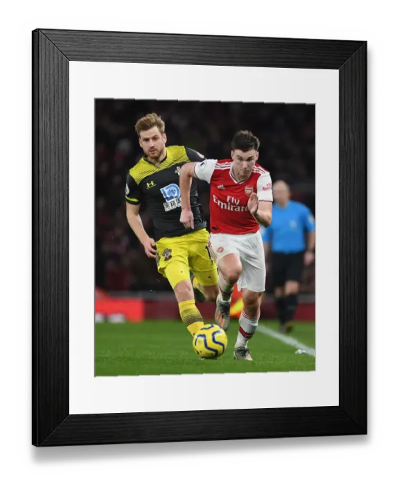 Framed Print : Arsenal's Kieran Tierney Outmaneuvers Southampton's Stuart Armstrong in Premier League Clash
