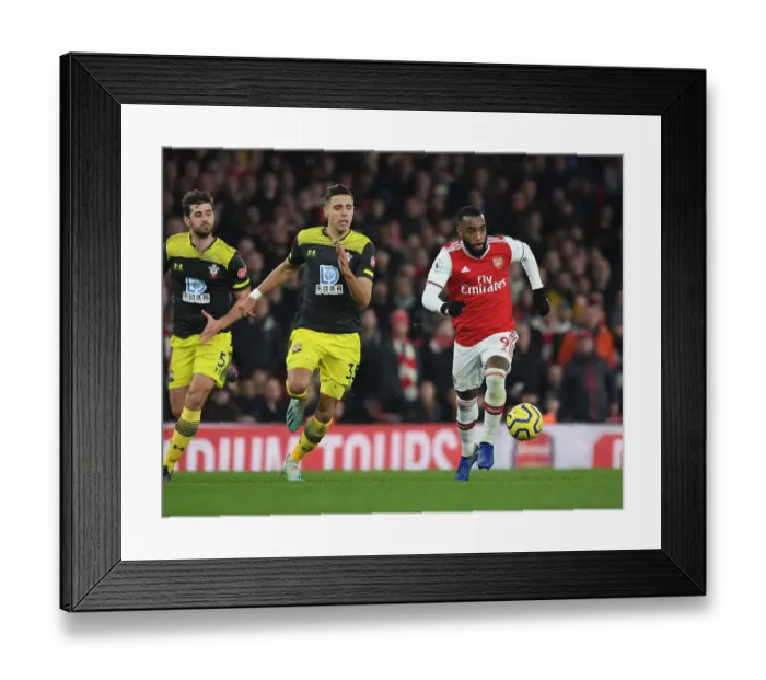 Framed Print : Arsenal's Lacazette Outmaneuvers Southampton's Bednarek in Premier League Clash