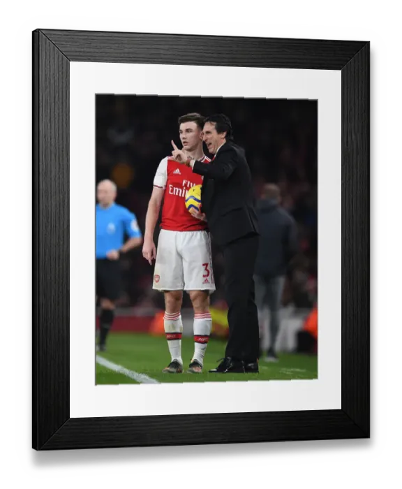 Framed Print : Focused Emery and Tierney: Uniting Forces at the Emirates Amidst Southampton Battle
