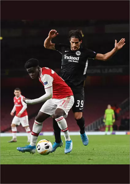 Arsenal's Bukayo Saka Faces Off Against Eintracht Frankfurt's Gonzalo Paciencia in Europa League Clash