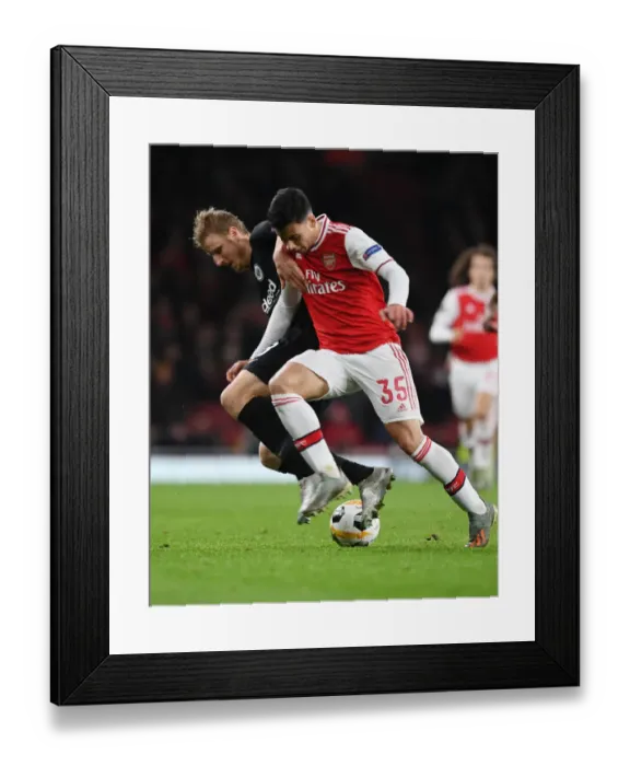 Framed Print : Clash of the Midfield Titans: Guendouzi vs. Hinteregger in Arsenal vs. Eintracht Frankfurt Europa League Battle