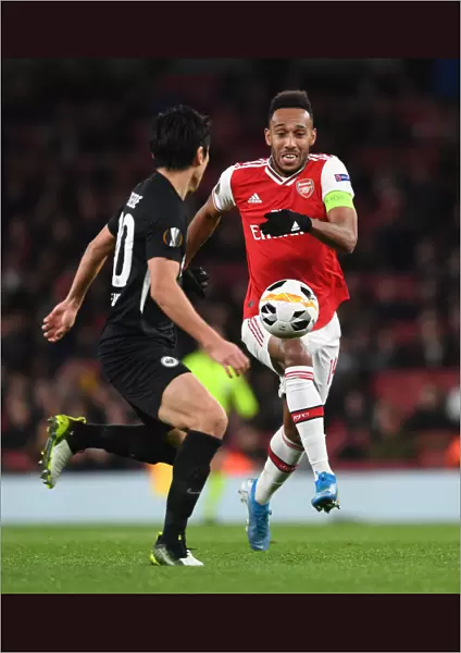 Arsenal's Aubameyang Clashes with Eintracht Frankfurt's Hasebe in Europa League Showdown